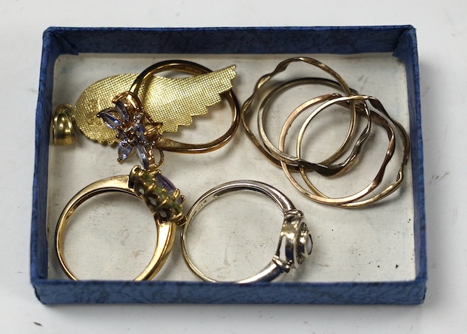 A modern 14k and gem set cluster ring, size L, gross weight 2.5 grams, together with three assorted 9ct rings, including gem set and a 9k leaf pendant, gross weight 10.8 grams. Condition - poor to fair